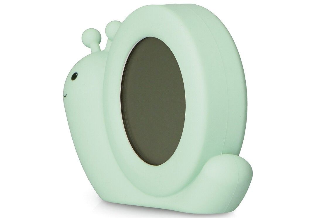 Grüner Schlaftrainer in Schneckenform. Runde Form, ohne Anzeige. Zwei Fühler oben.