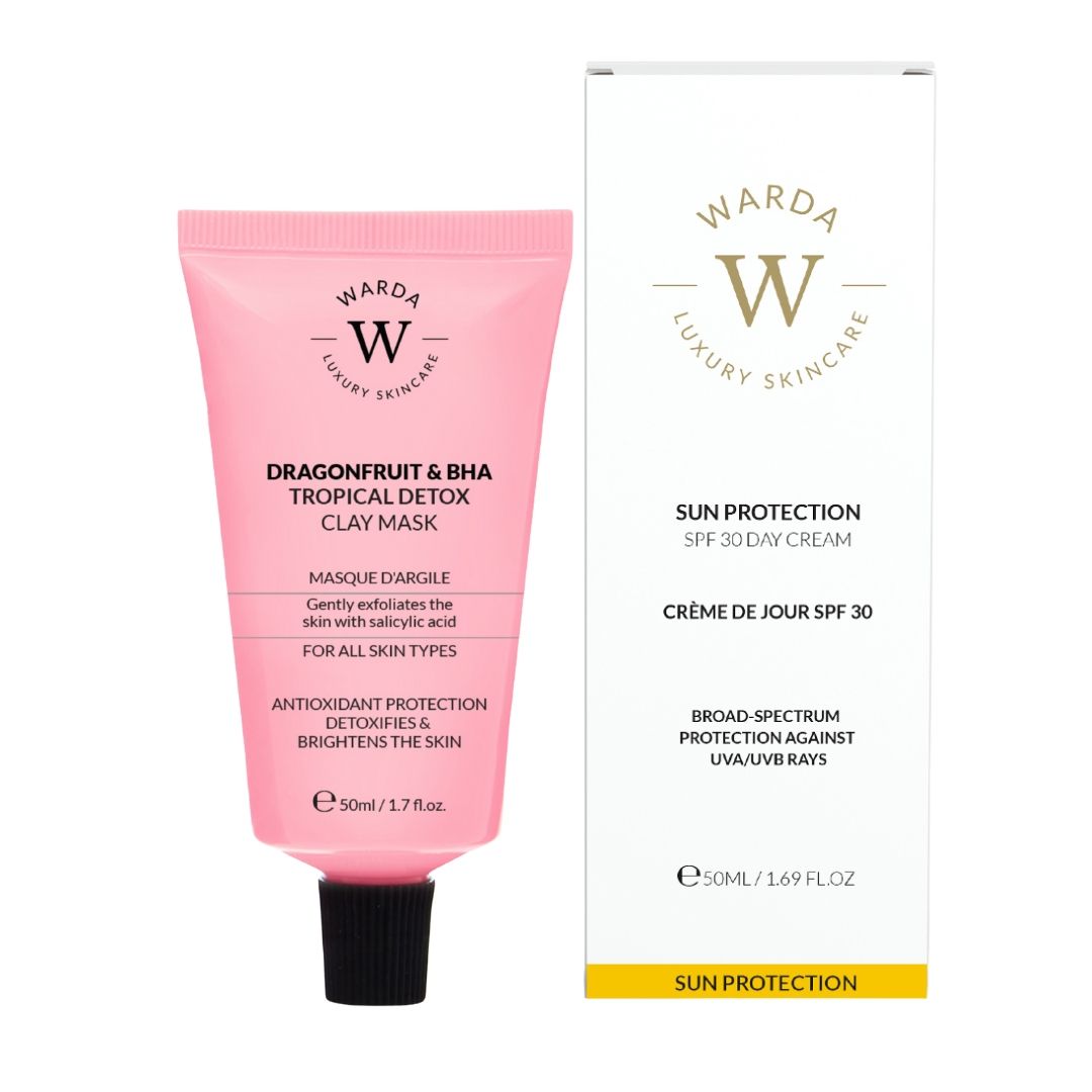 Rosa Tube mit schwarzem Deckel und weißer Schachtel. Aufdruck: Warda Luxury Skincare, Dragonfruit & BHA Clay Maske, LSF 30 Tagescreme.