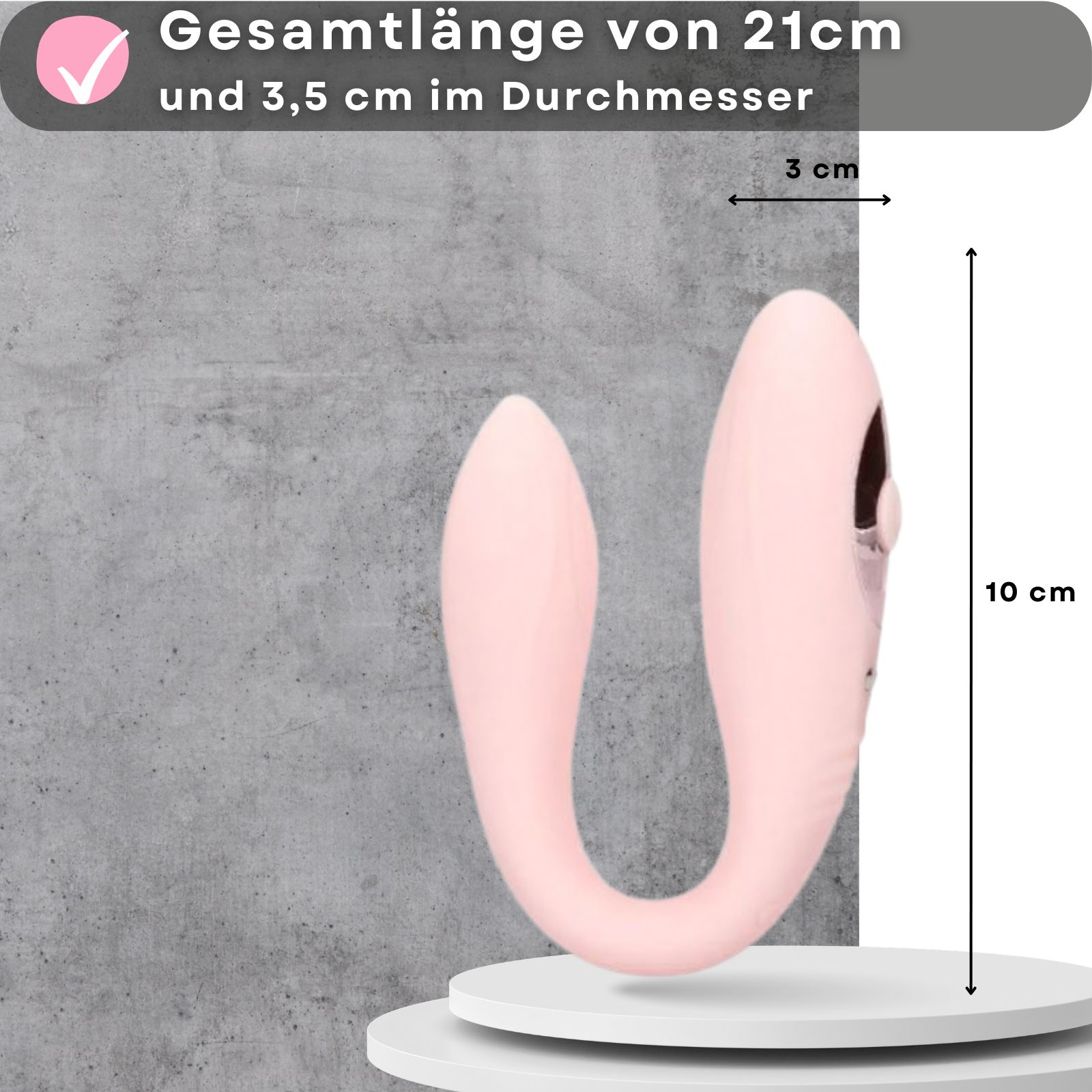Rosa Partner-Vibrator. Abmessungen: 21 cm Länge, 3,5 cm Durchmesser. Auf Podest.