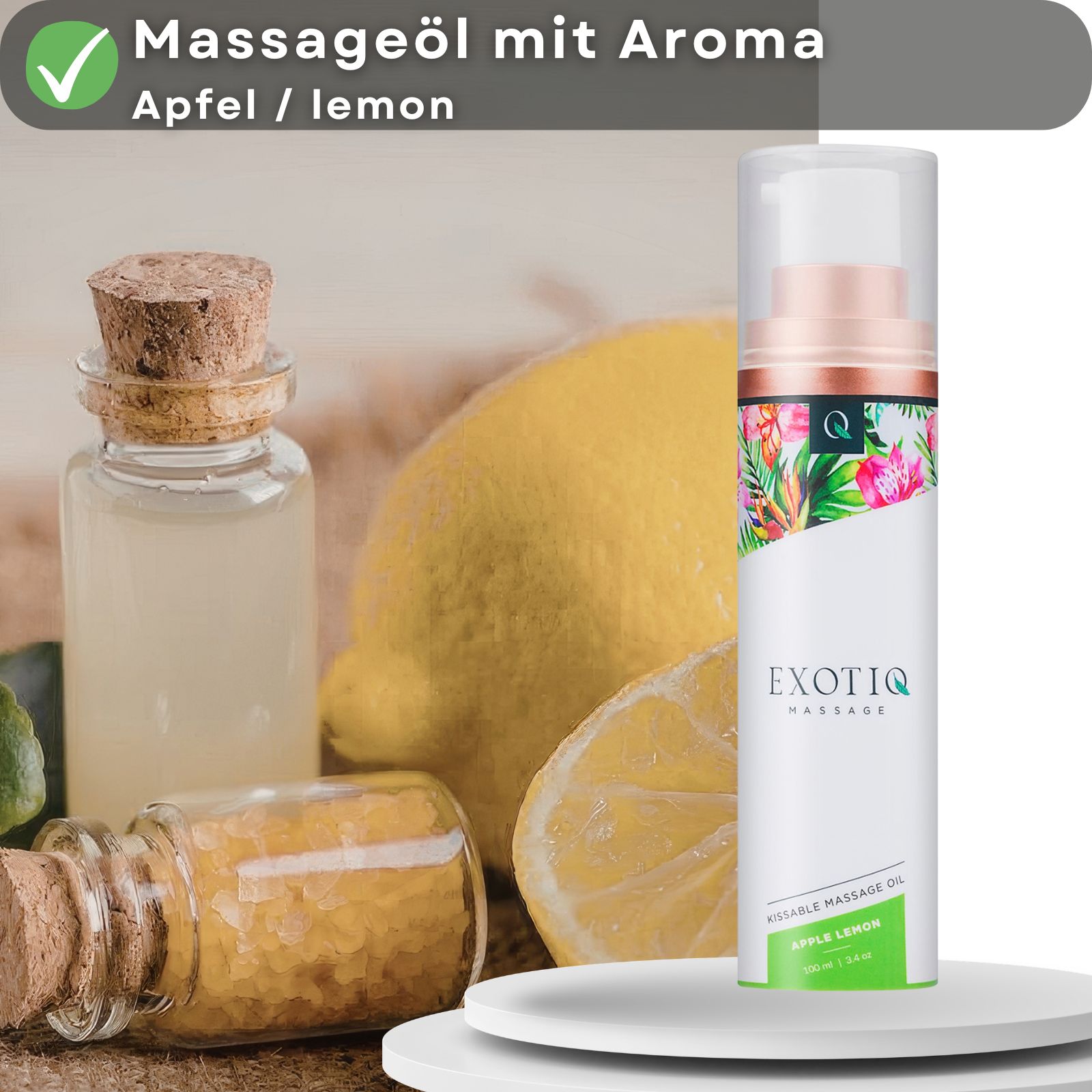 Produktpräsentation mit Massageöl-Flasche, Zitrone, und Fläschchen. Text: Massageöl mit Aroma Apfel/Lemon.