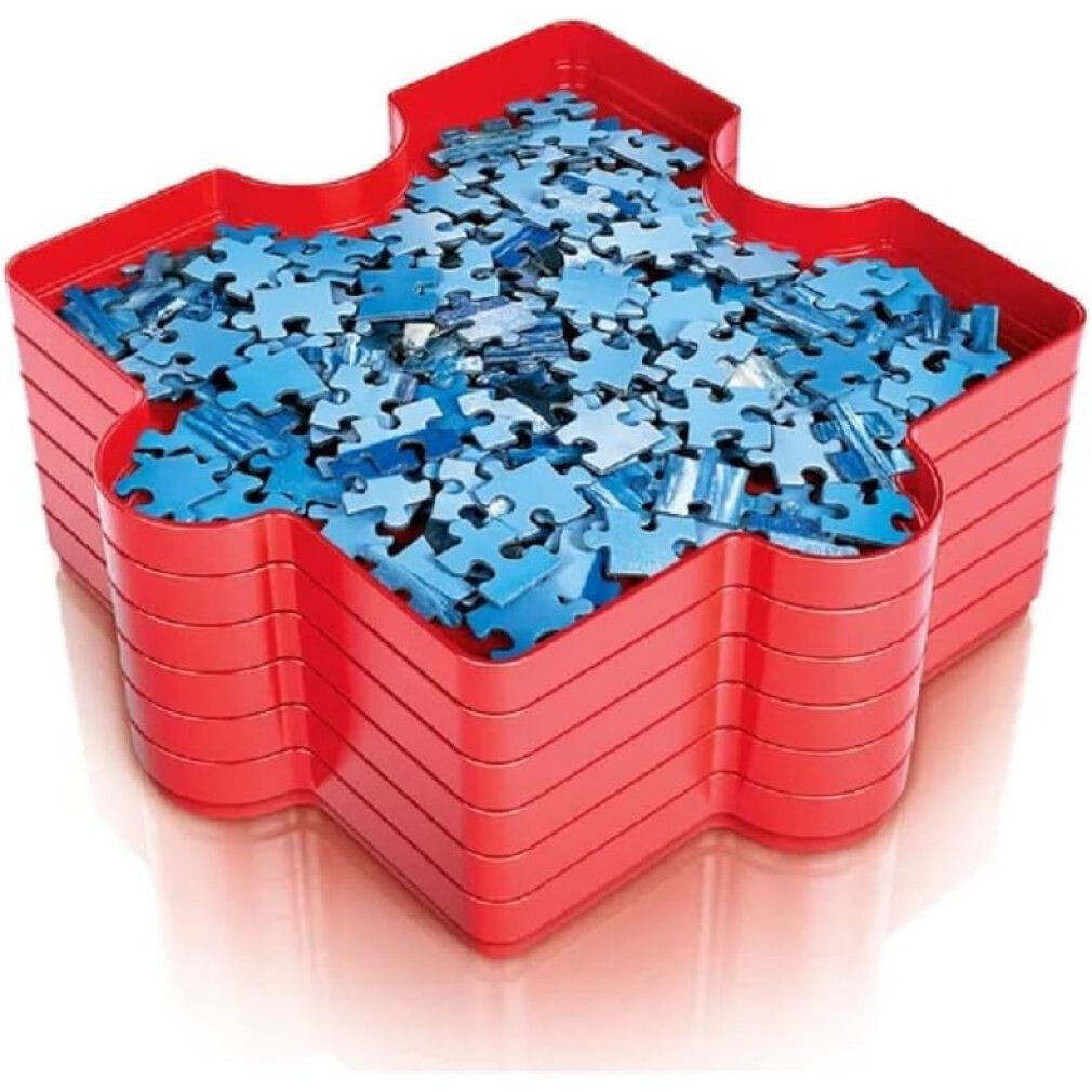 Rotes Stern-Tablett, gefüllt mit blauen Puzzleteilen. Mehrere Tabletts sind sichtbar.