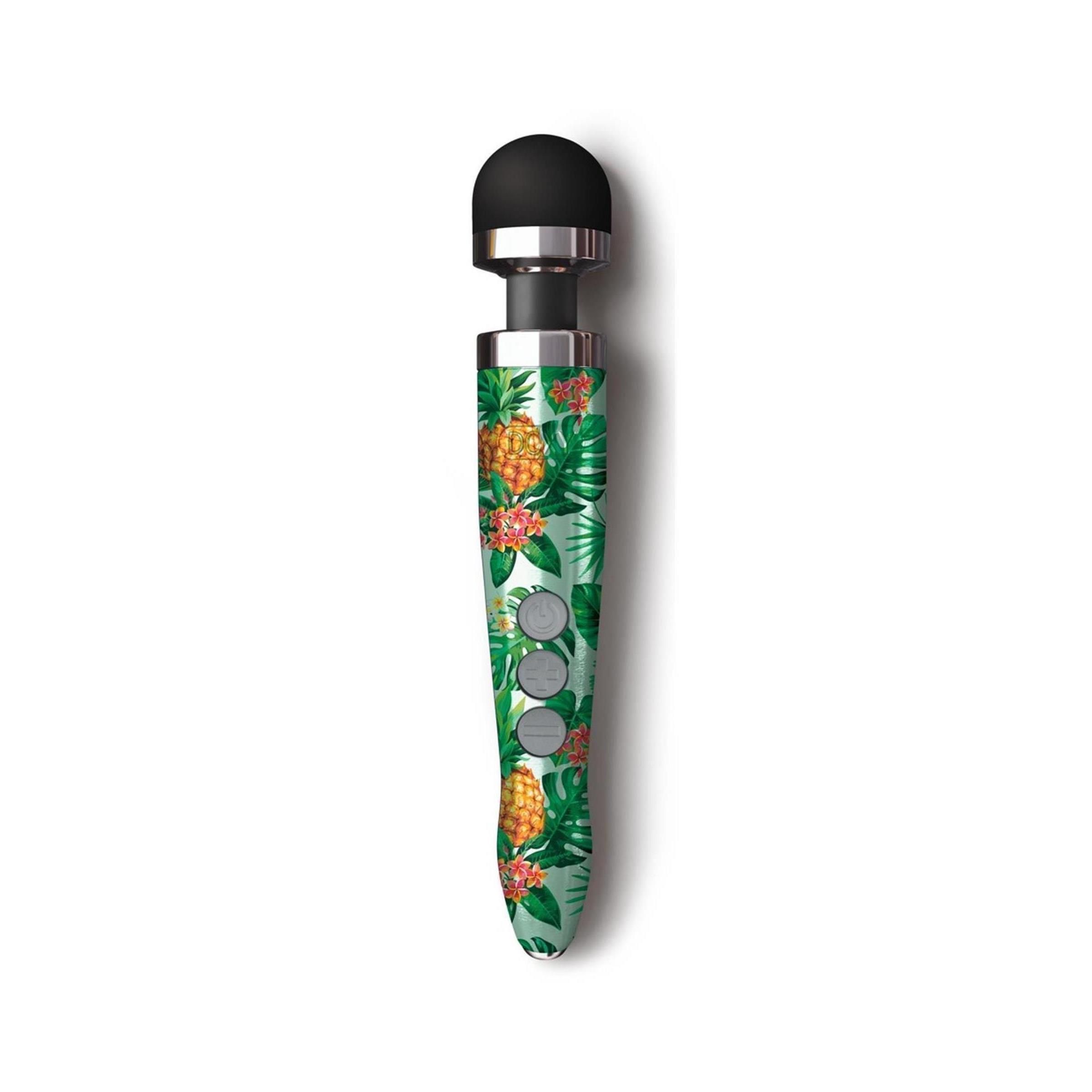 Vibrator mit schwarzem Kopf und grünem Griff mit Ananas- und Blättermuster. Drei Knöpfe. Metallring.