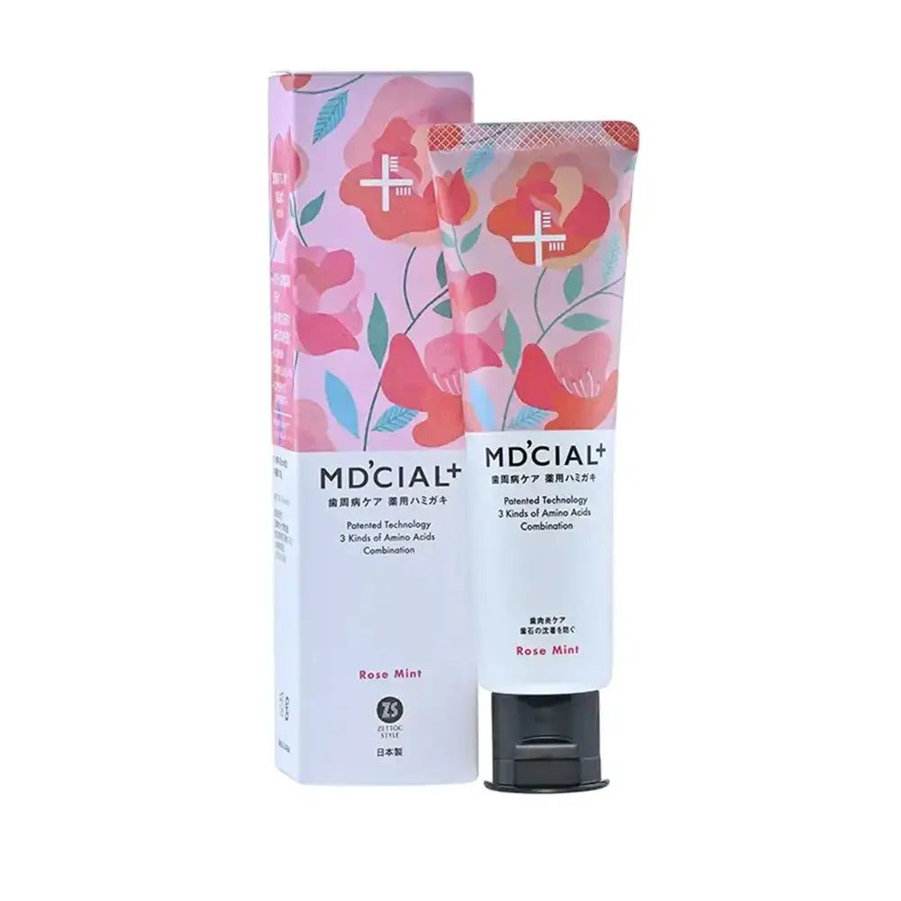 Zahnpasta-Tube, MD'CIAL+, Rose Mint, mit Verpackung. Floral bedruckt. Weißer Hintergrund.