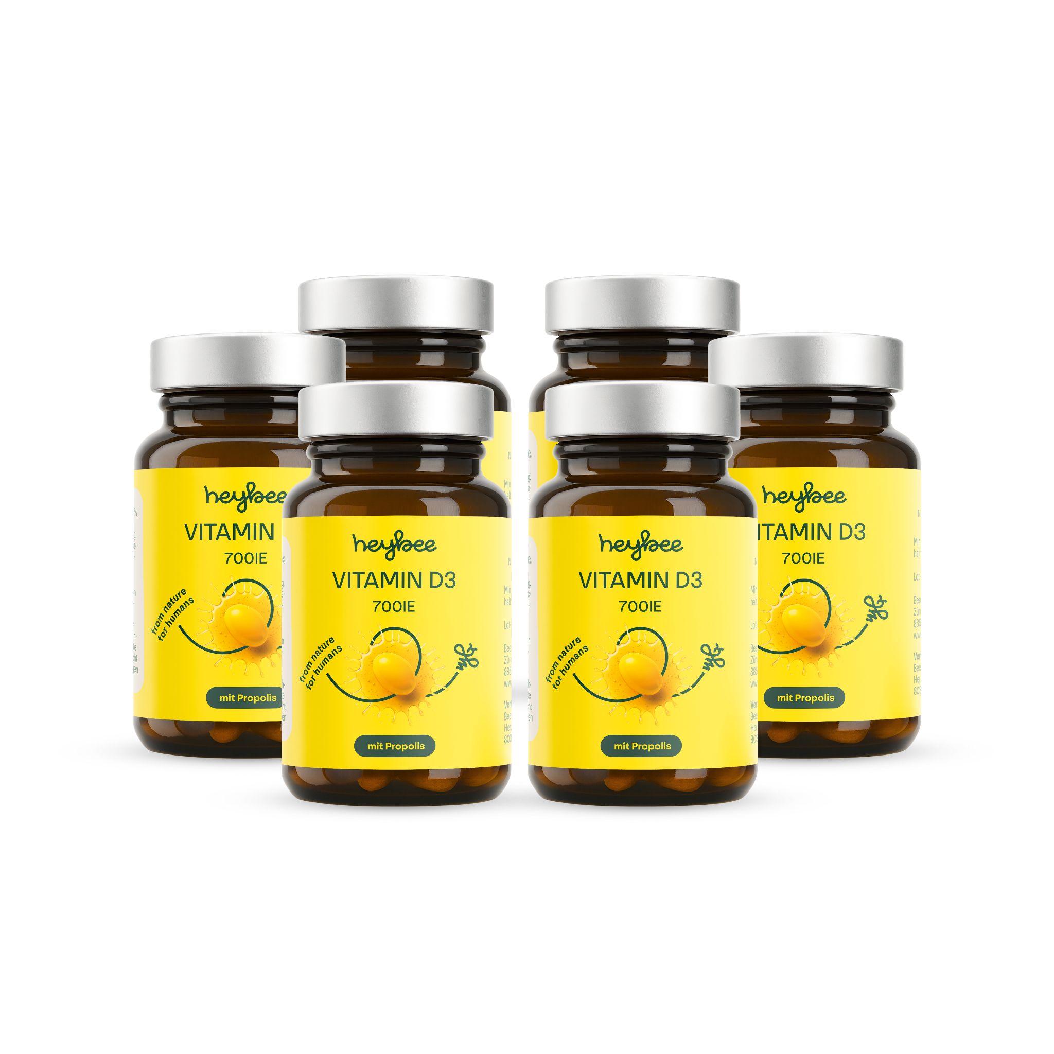 Sechs Flaschen heybee Vitamin D3 700 I.E. + Propolis. Braune Glasflaschen mit gelben Etiketten. Aufschrift: Vitamin D3, 700 I.E., mit Propolis.