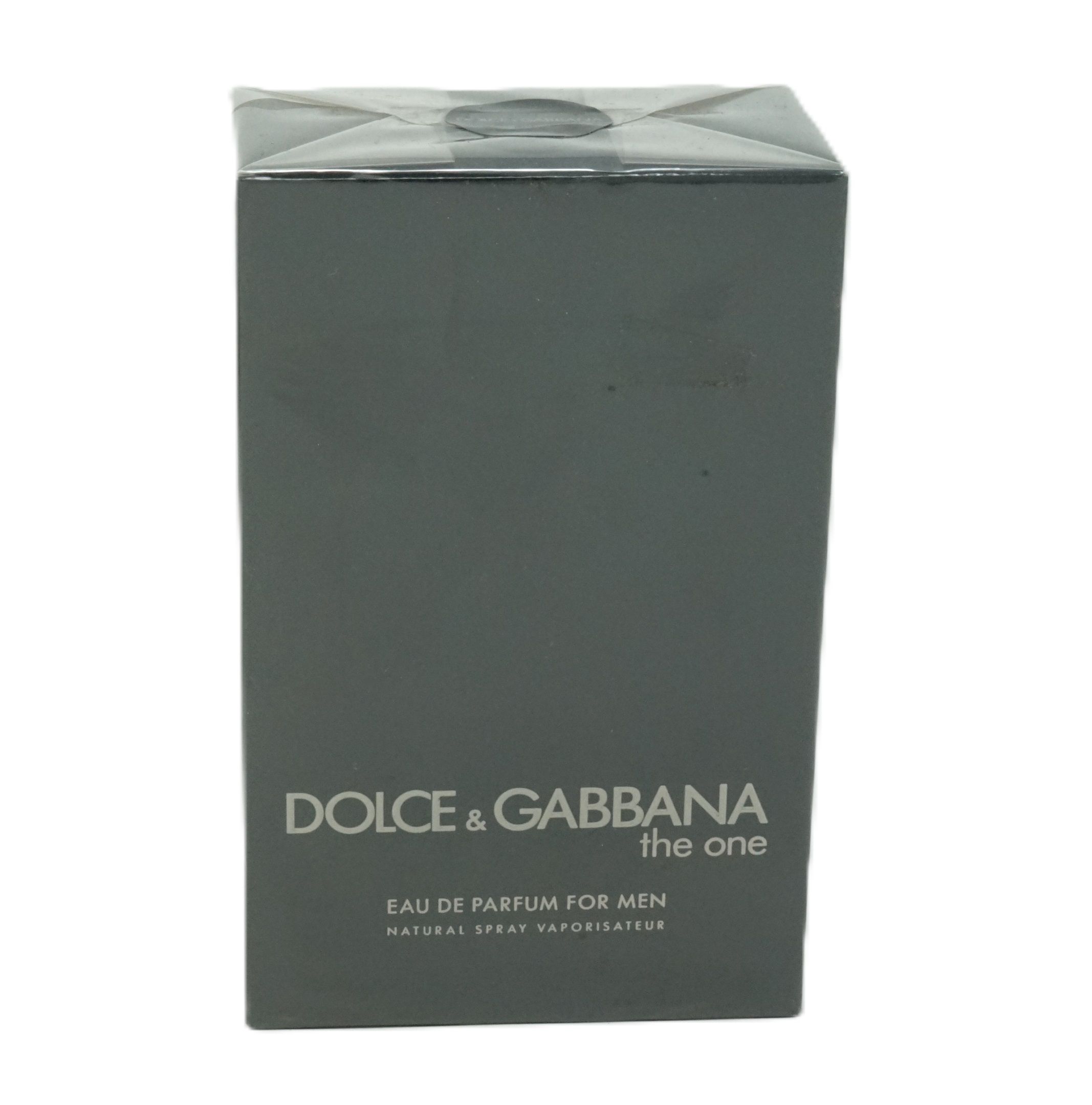 Dunkelgraue rechteckige Verpackung. Aufschrift: DOLCE & GABBANA the one. Eau de Parfum For Men. Natural Spray Vaporisateur.