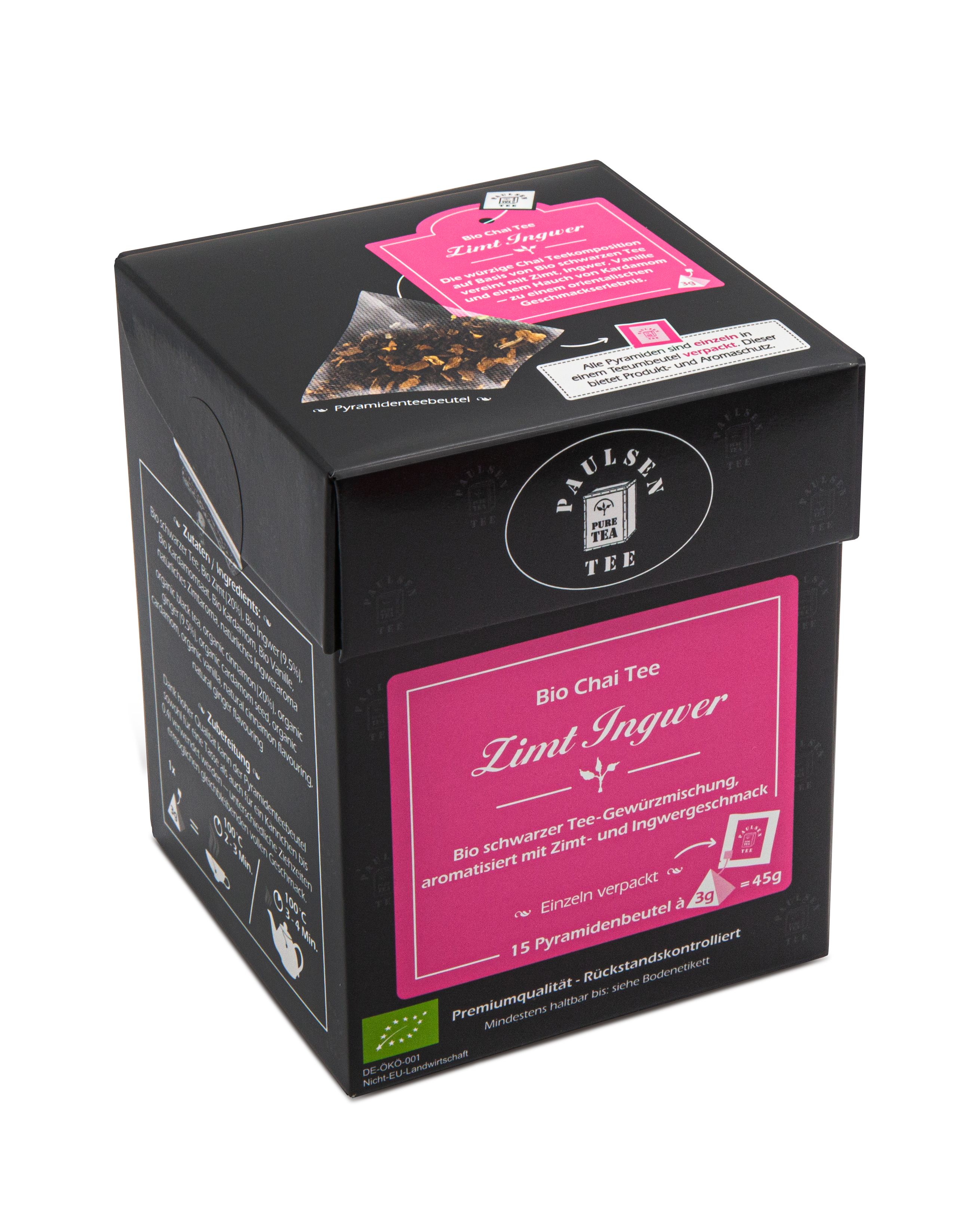 Schwarze Tee-Box mit rosa Etikett. Aufschrift: Bio Chai Tee Zimt Ingwer. 15 Pyramidenbeutel, 45g. Bio-Siegel.