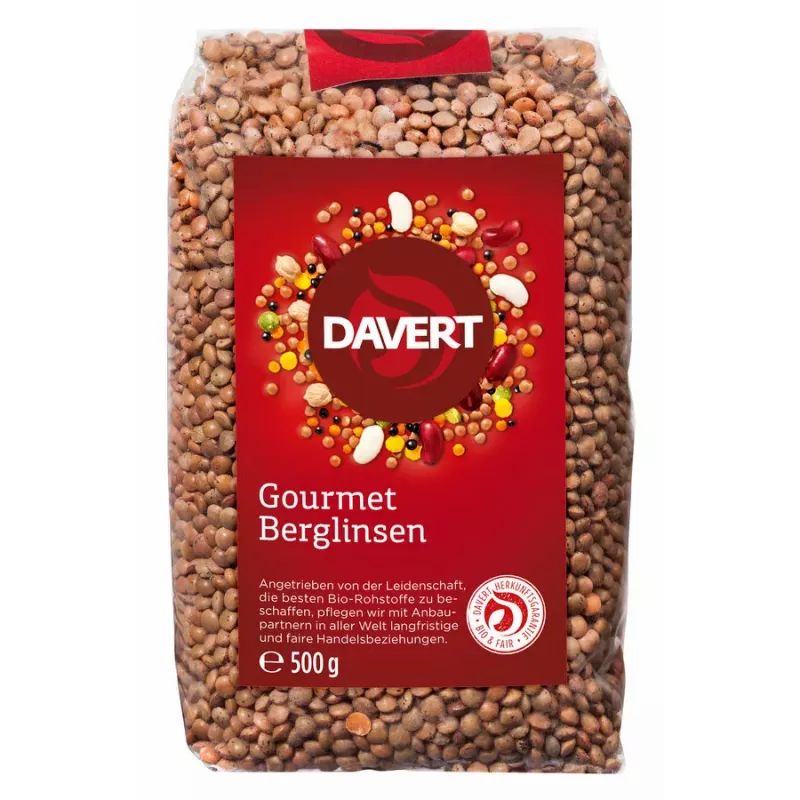 Transparente Verpackung mit braunen Berglinsen. Rotes Etikett mit "DAVERT" und "Gourmet Berglinsen". Bio-Siegel und 500g.