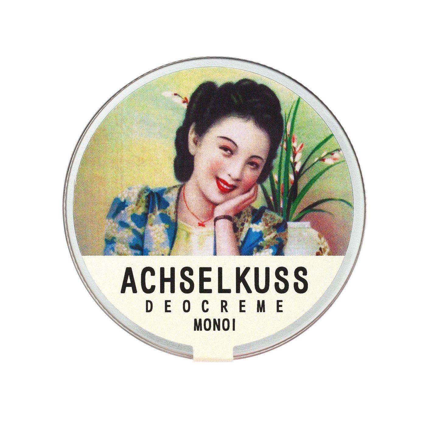 Runde Dose mit Deckel. Auf dem Deckel ist eine Frau abgebildet, darunter steht "ACHSELKUSS DEOCREME MONOI".