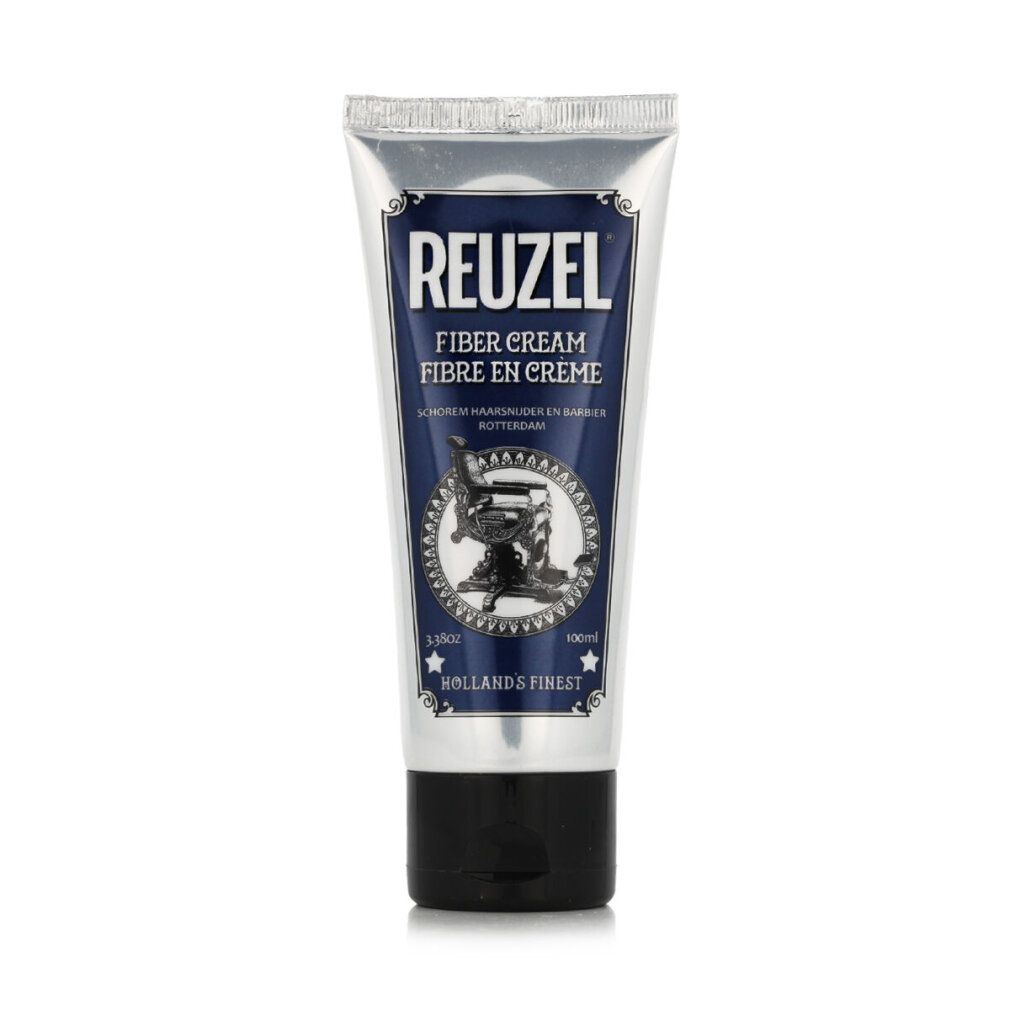 Silberne Tube mit blauem Etikett. Aufschrift REUZEL FIBER CREAM. Abbildung eines Friseurstuhls. Schwarzer Schraubverschluss.